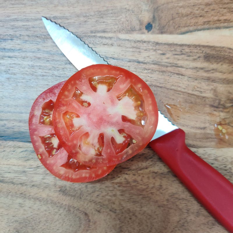 slicing tomato with victorinox paring knife